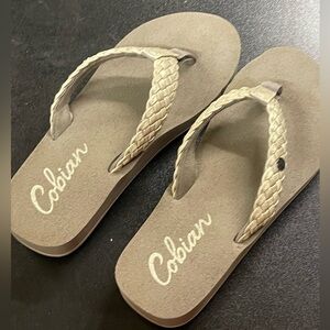 Tan Cobian flip-flops